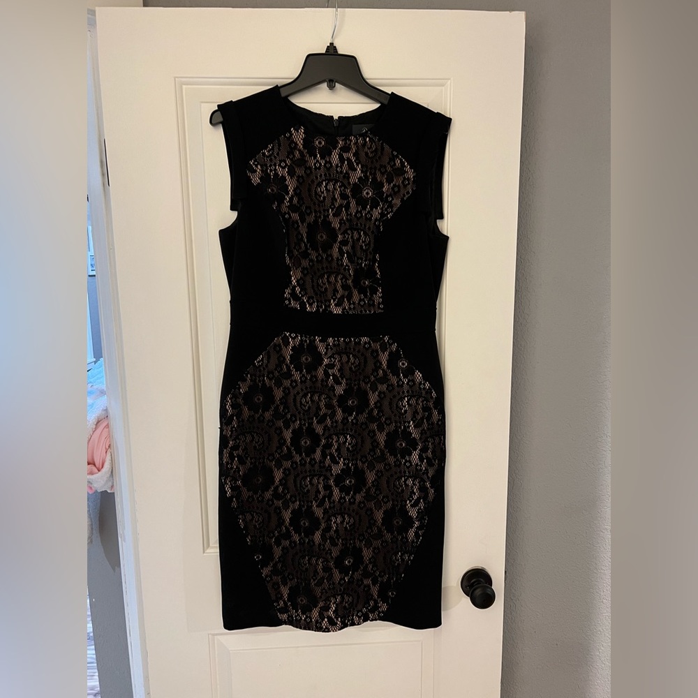 Adrianna Papell. Black dress, falls above knee.